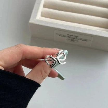 Silver Bow Statement Ring shop name